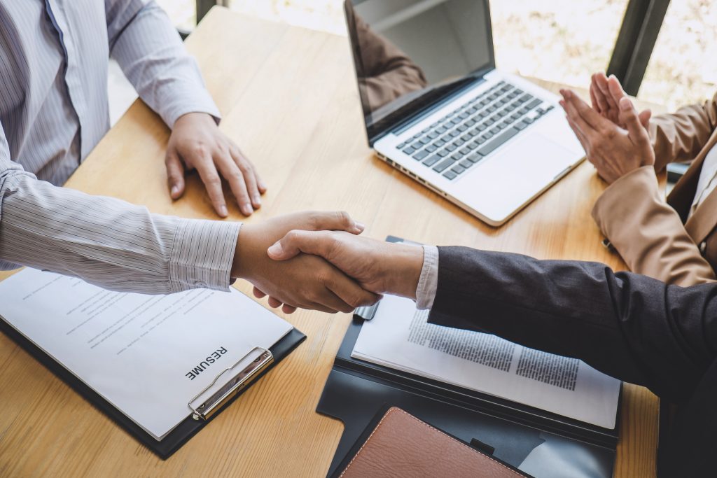 Greeting New Colleagues Handshake While Job Interviewing Male